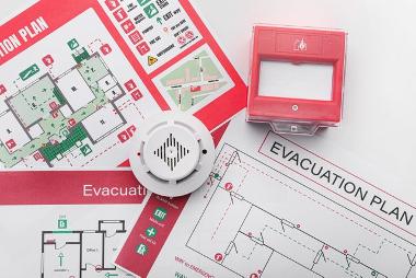 Fire safety courses employer training. Health and safety, examining building evacuation plans.