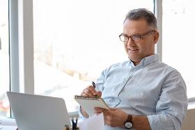 Online training courses to upskill employees. Man learning new skills.
